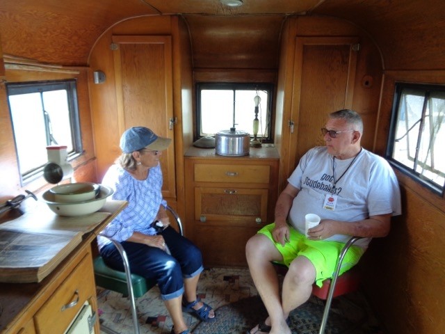 Toni & Frank discussing his unique 1937 Montgomery trailer