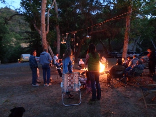 Evening campfire & chandeliers in the trees