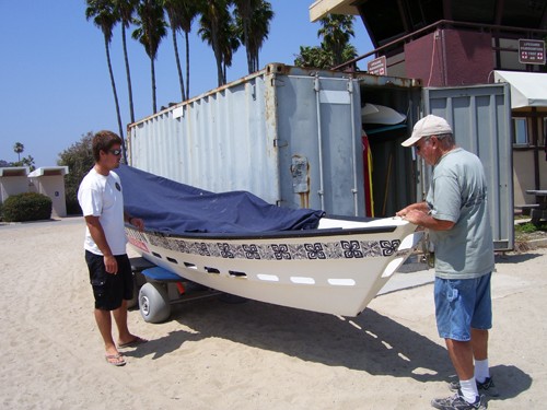 
Lifeguard Jeff patiently explains how the dory is used to cut through the surf. 