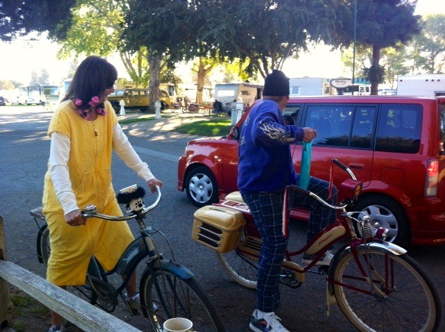 Donna and George participate in the Saturday morning pajama bicycle parade.